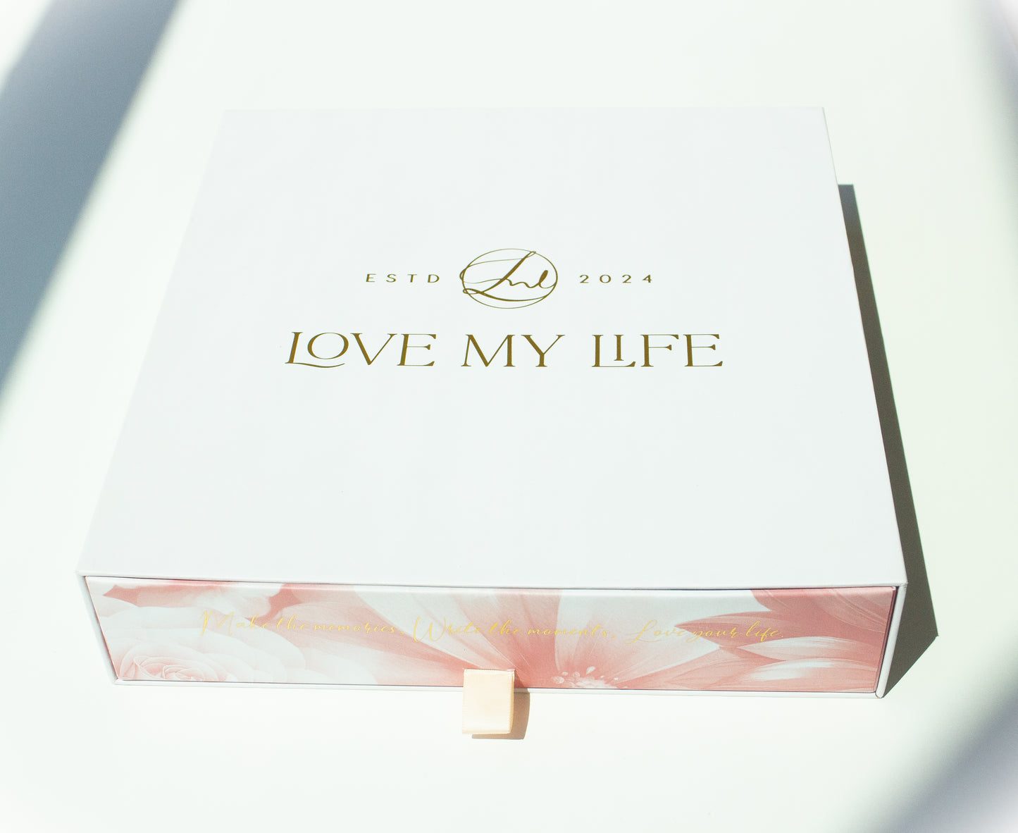 Product packaging with 'LOVE MY LIFE' branding on a white background