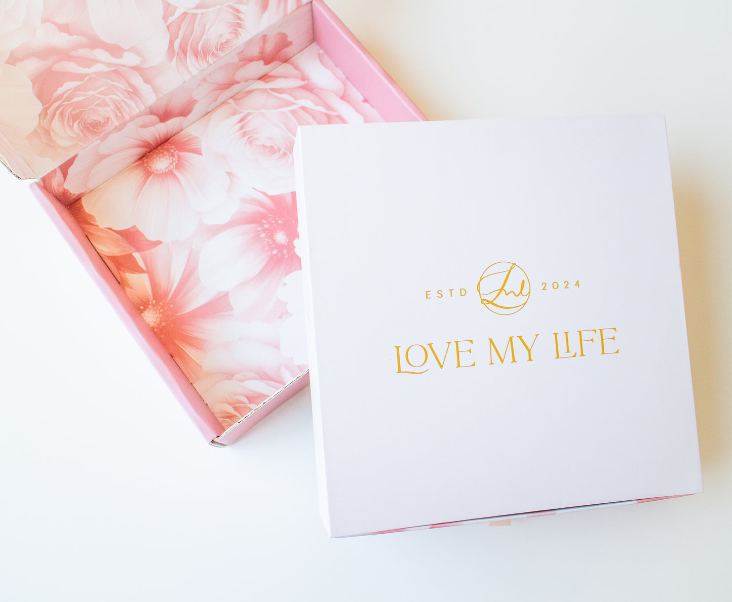 Product packaging with floral design and 'Love My Life' branding on a white background