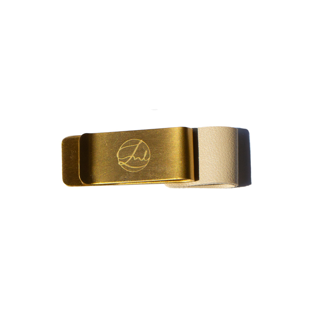 Gold pen clip with a brand logo on a white background