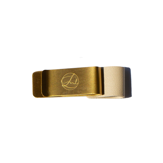 Gold pen clip with a brand logo on a white background
