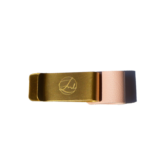 Gold and rose gold pen clip with a logo on a white background