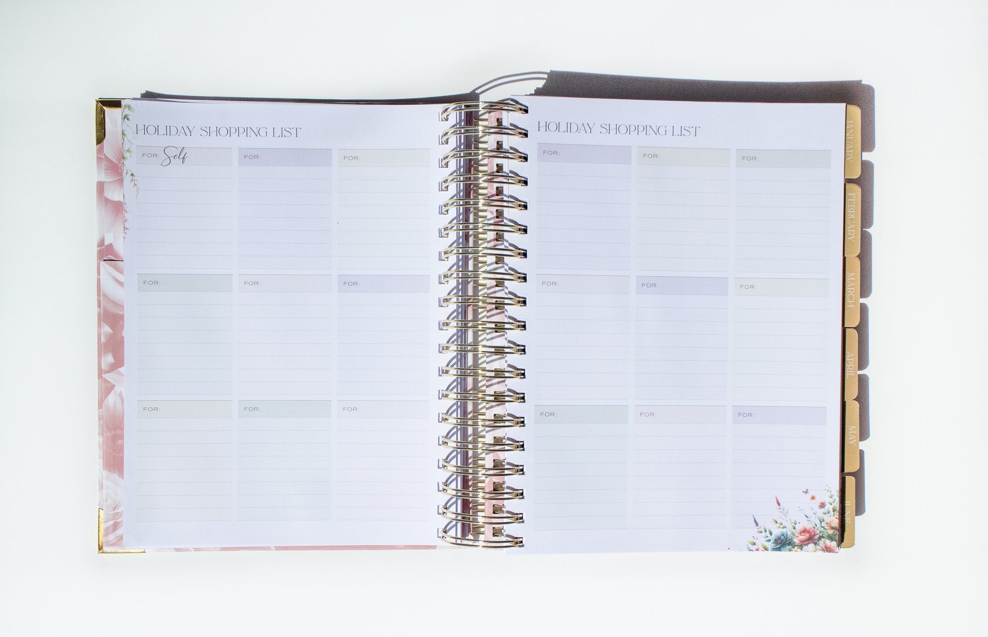 Open planner with floral design on a white background