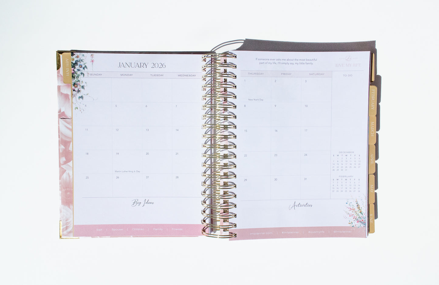 Open planner with floral design on a white background