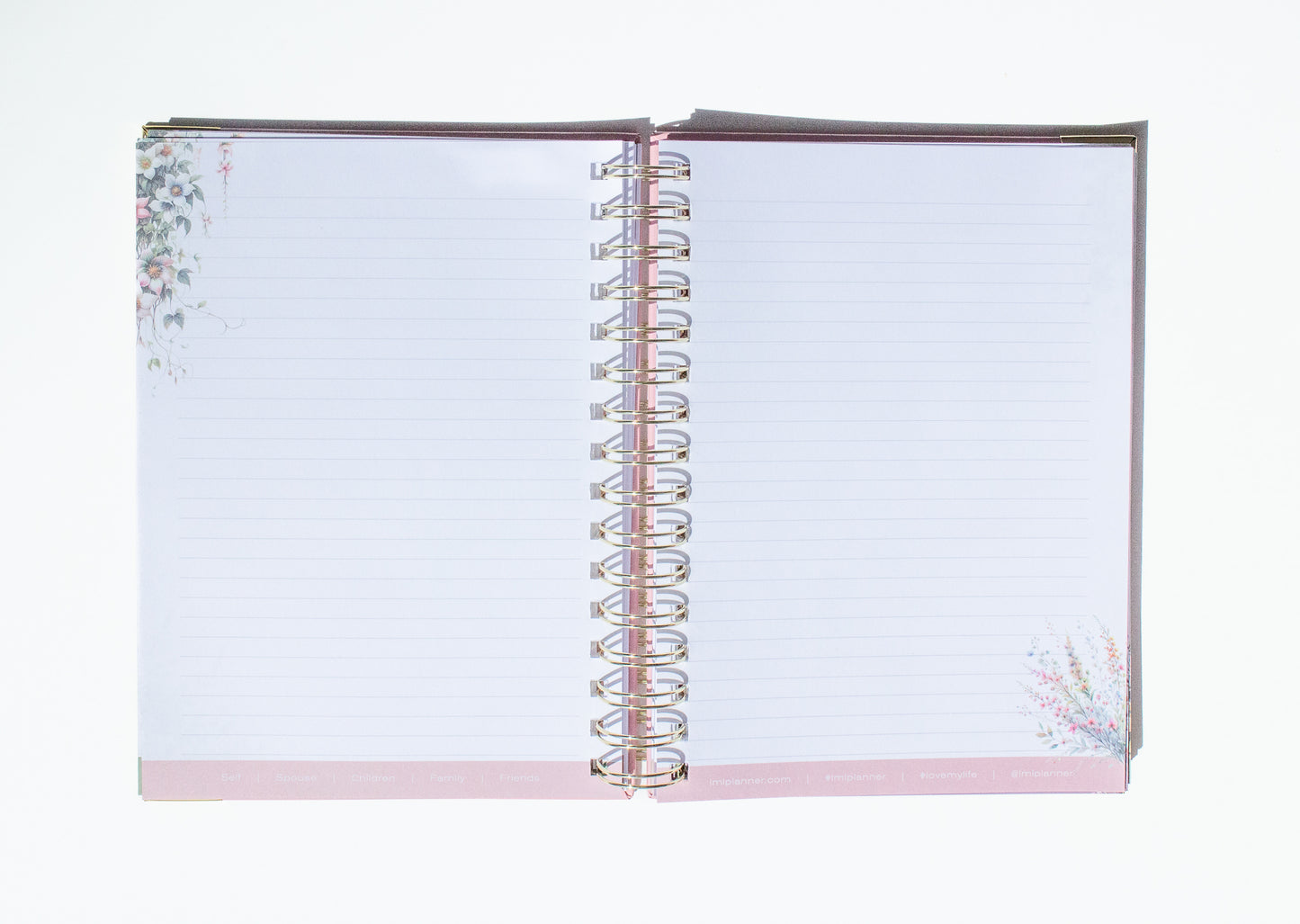 Open notebook with floral design on a white background