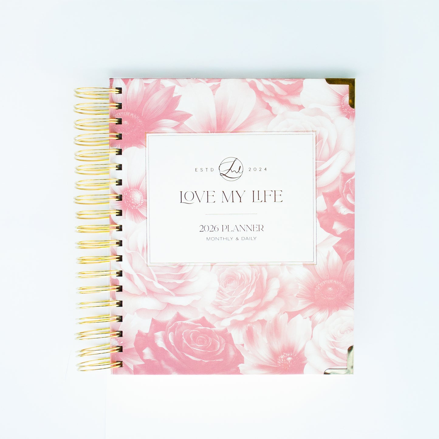 Planner with pink floral design and 'Love My Life' text on a white background