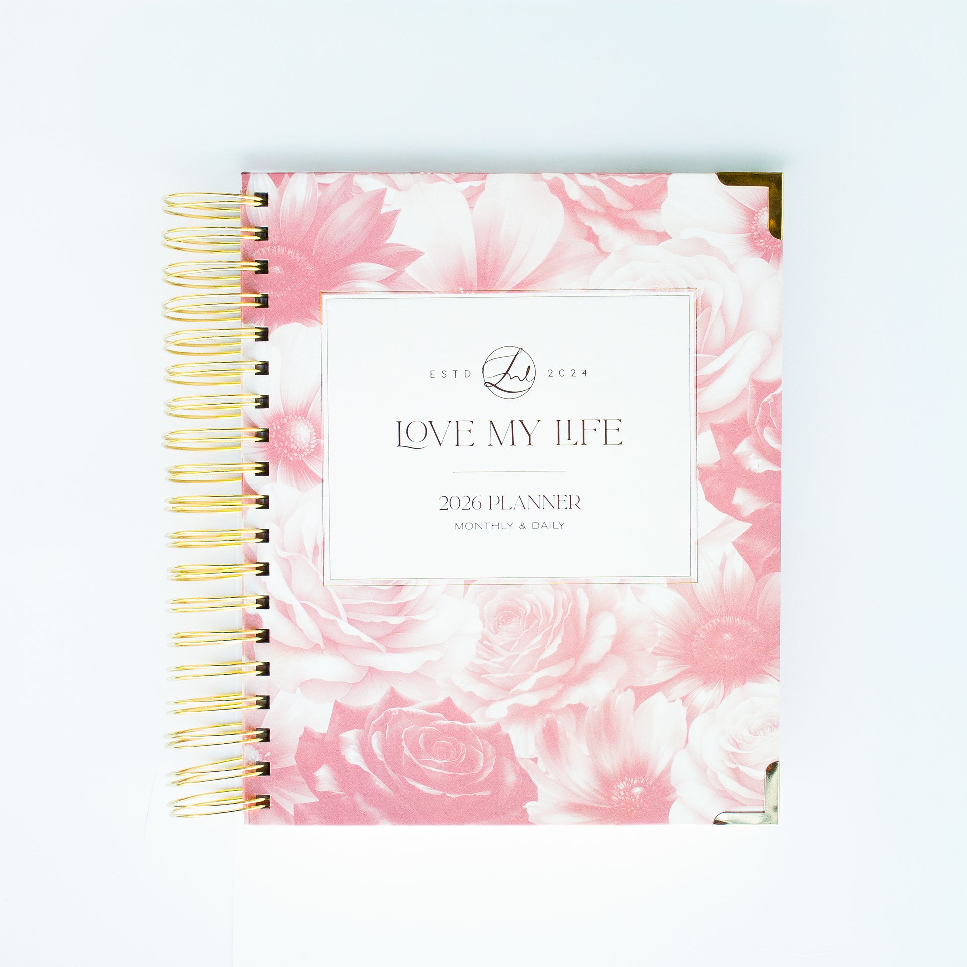 Planner with pink floral design and 'Love My Life' text on a white background