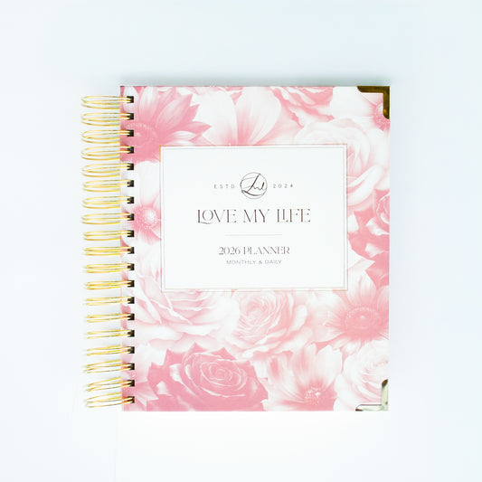 Planner with pink floral design and 'Love My Life' text on a white background