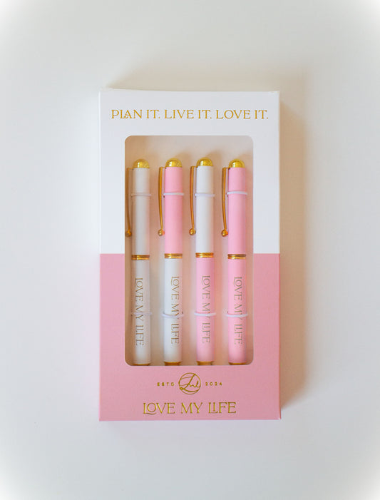 Set of pink and gold pens in a box with 'Love My Life' branding on a light background.